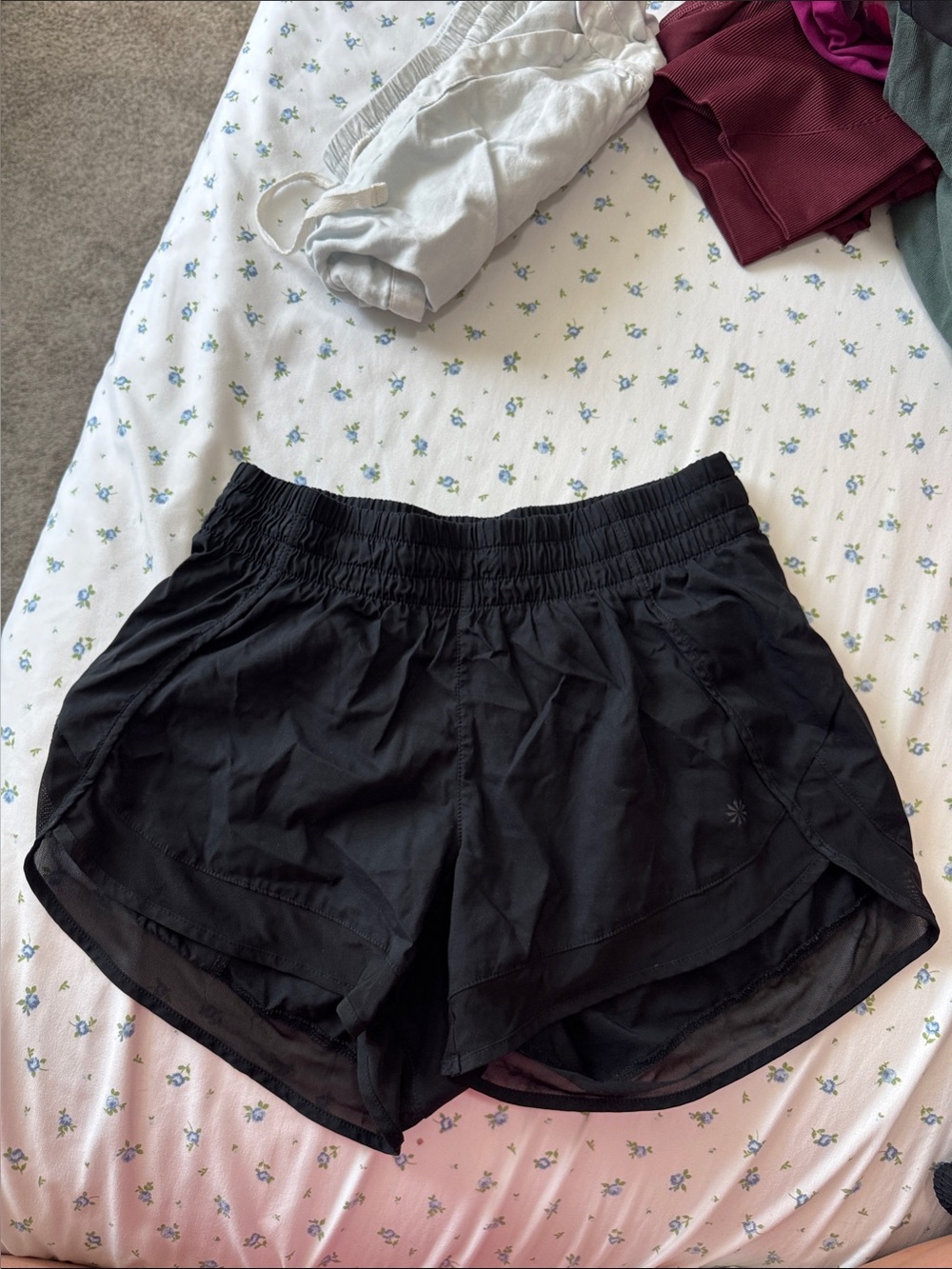 Athleta Black lined running shorts with zip pocket